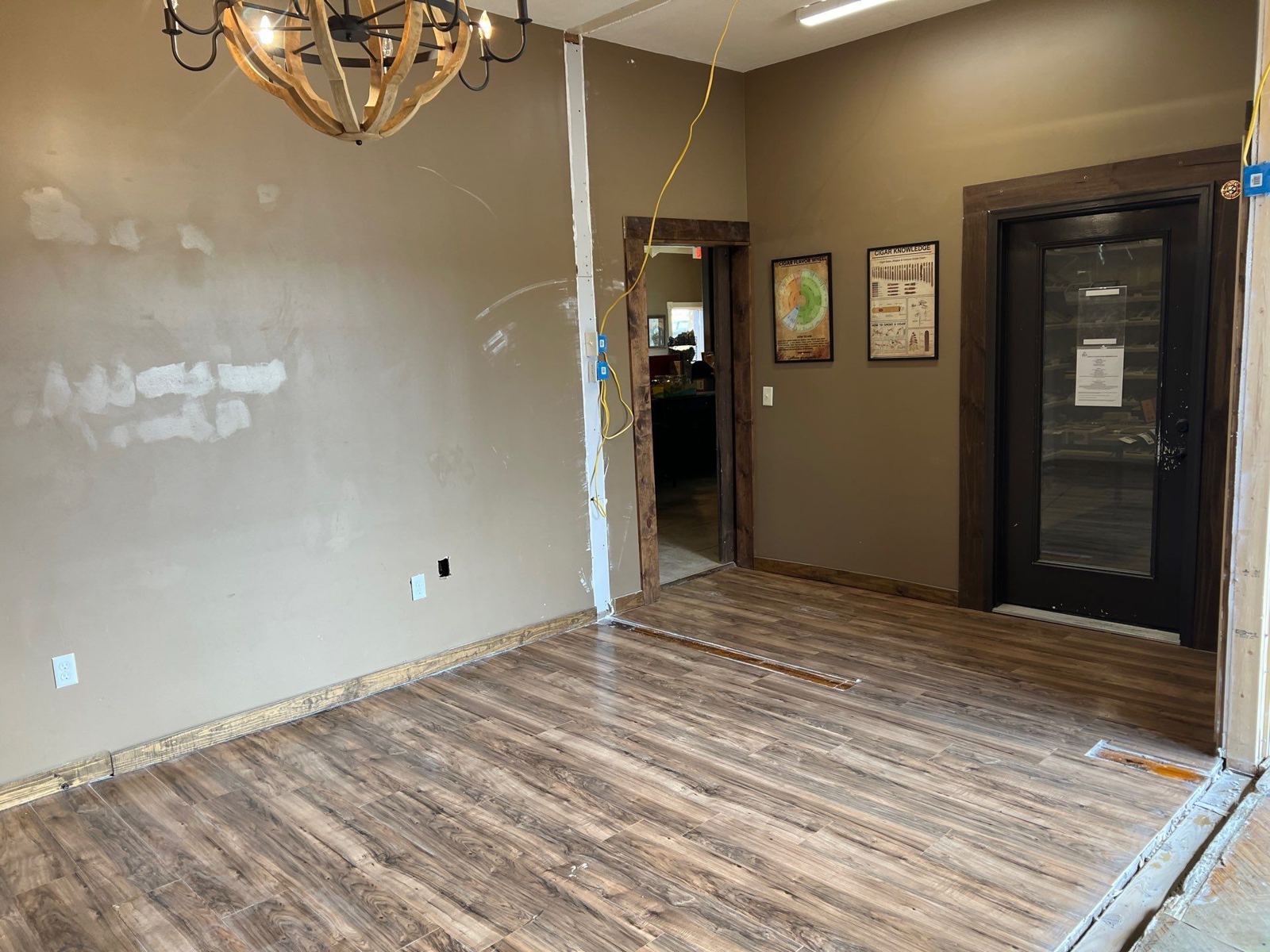 New plank flooring leading to the walk-in humidor door